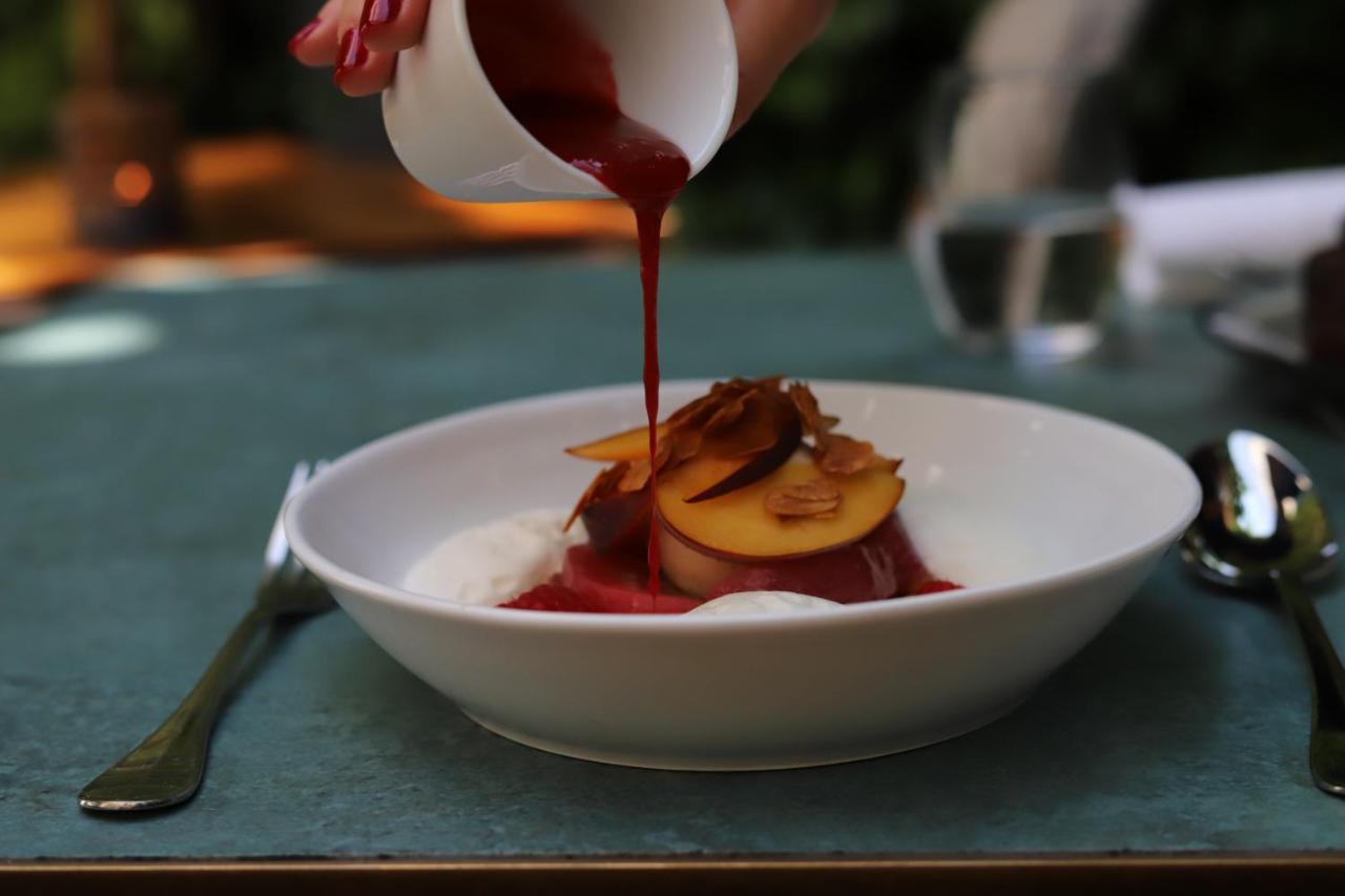 Maison Breguet Paris Exterior photo A dessert being drizzled with a sauce